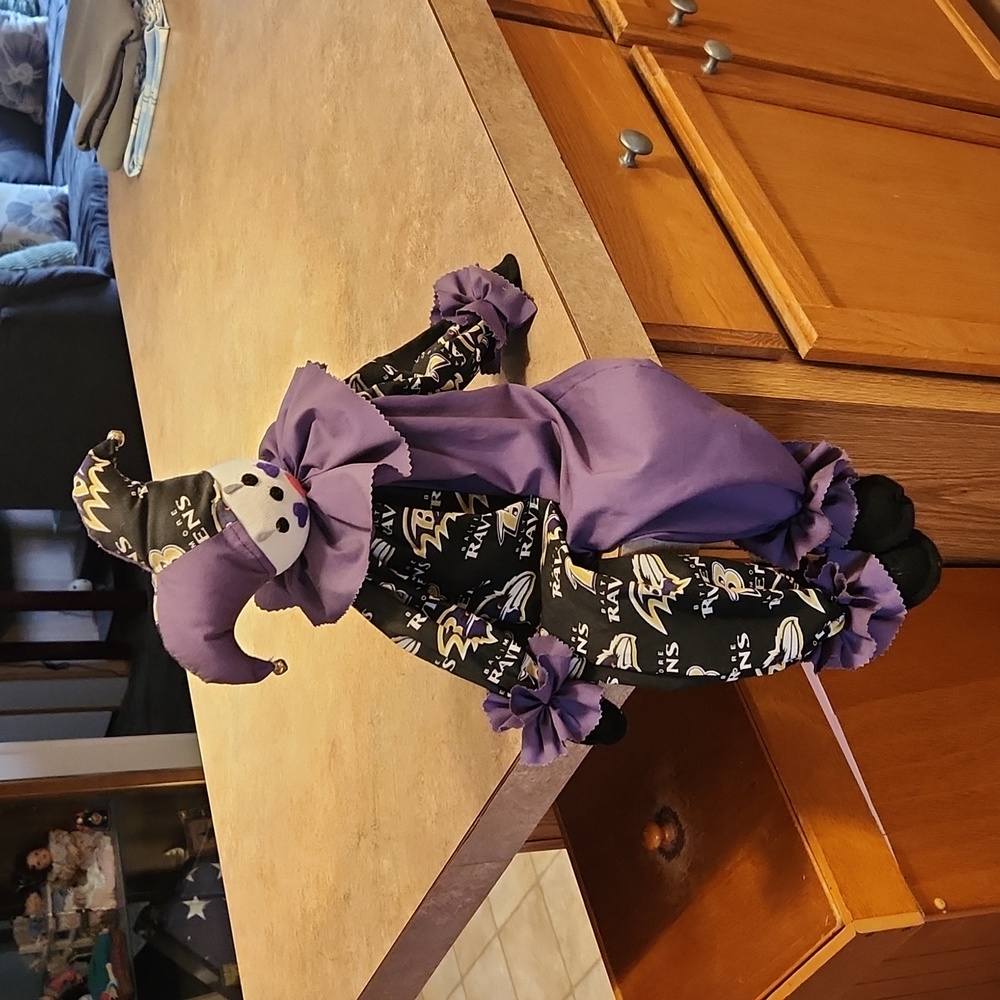 Shelf sitting ravens clown